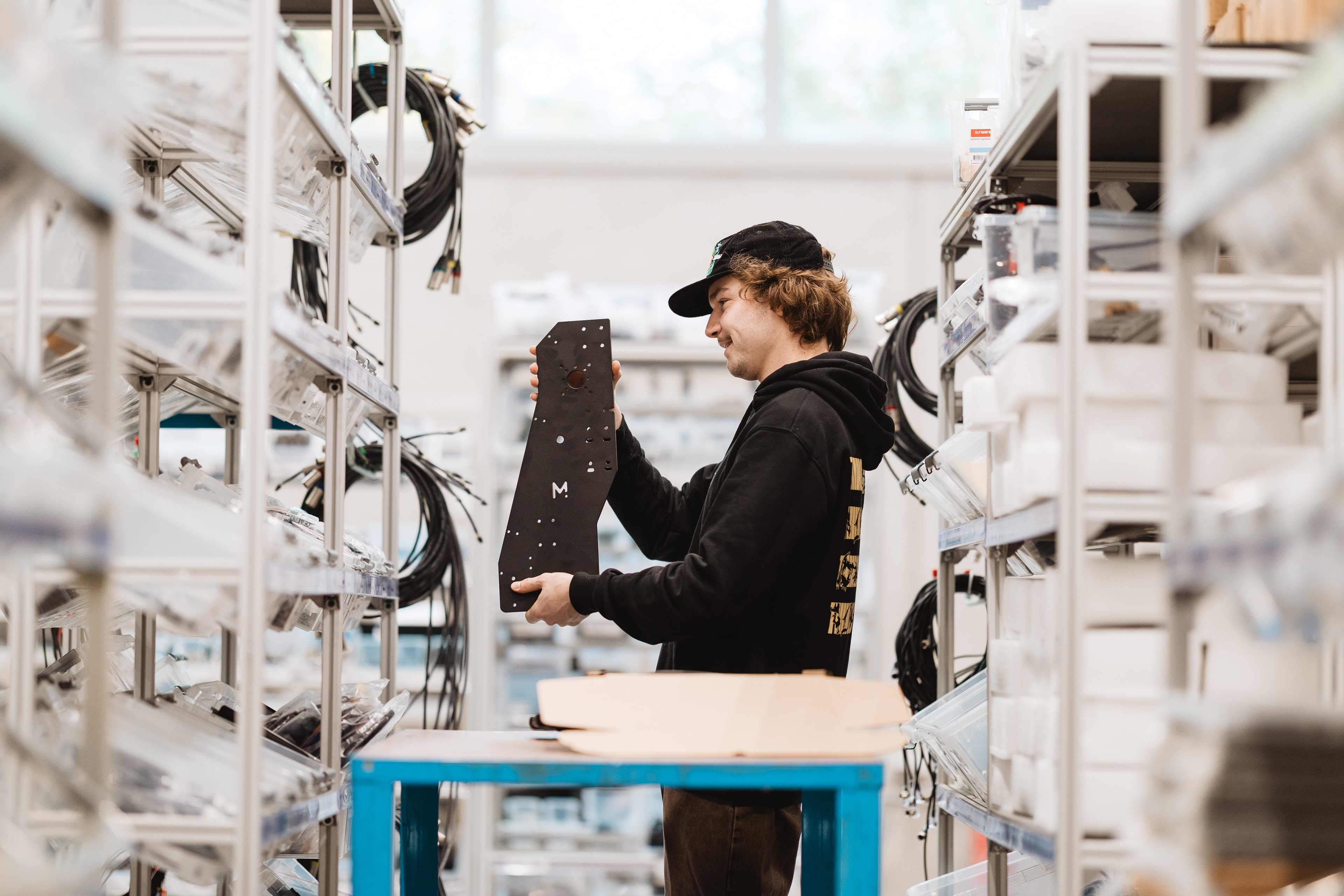 Matthieu in the Mekanika workshop picking elements for the ongoing order