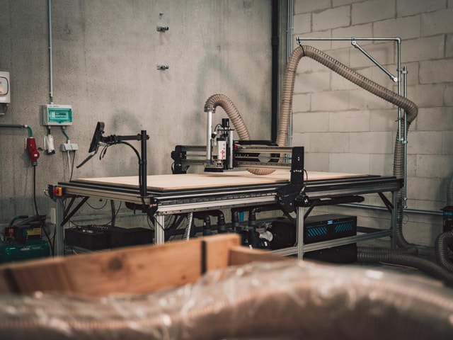 The Mekanika Fab in a warehouse milling some plywood