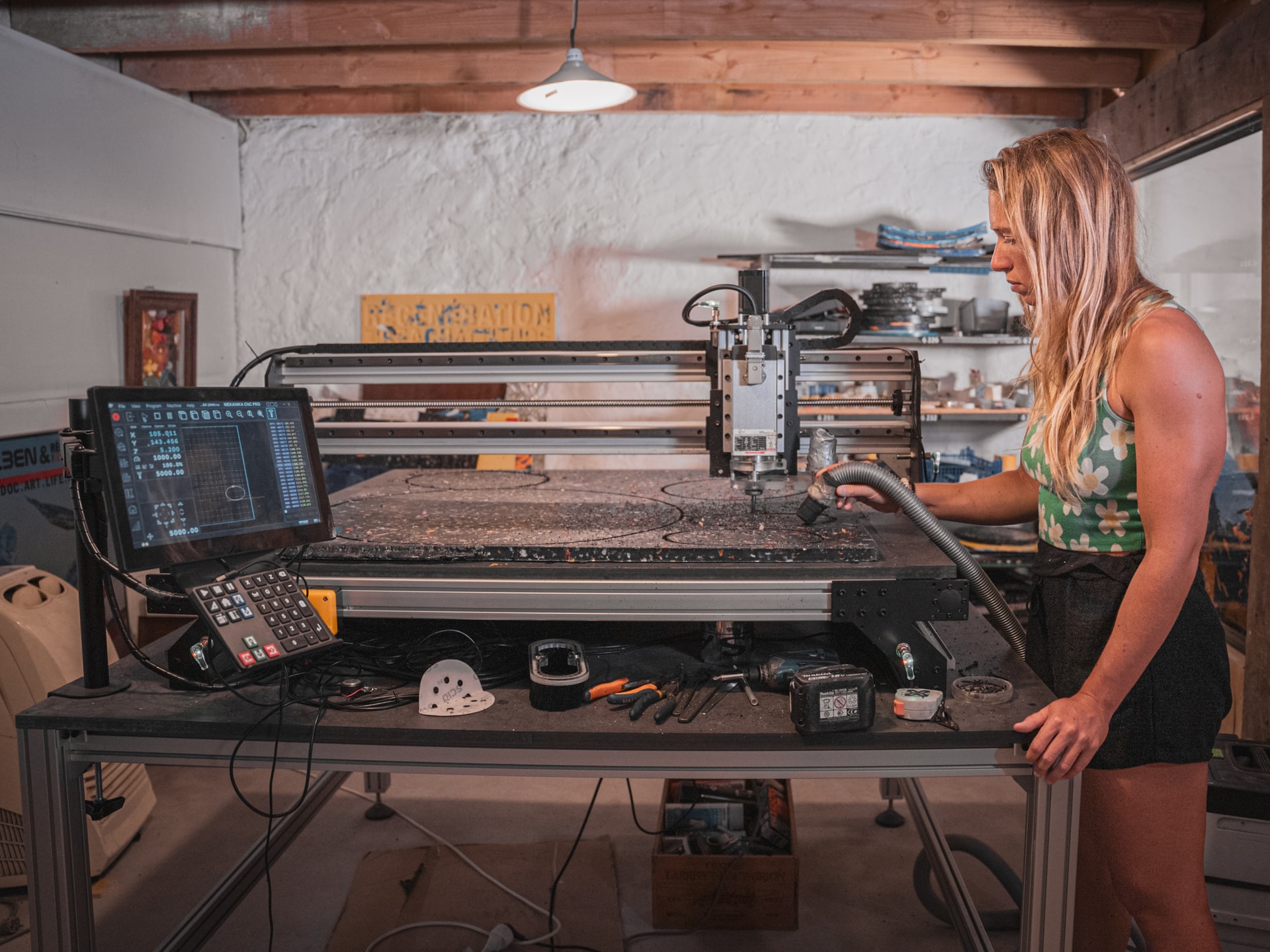 Mekanika pro CNC milling a recycled plastic panel at regeneration beach attitude's workshop in France