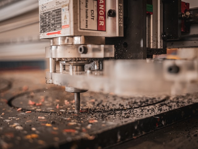 Mekanika pro CNC milling a recycled plastic panel at regeneration beach attitude's workshop