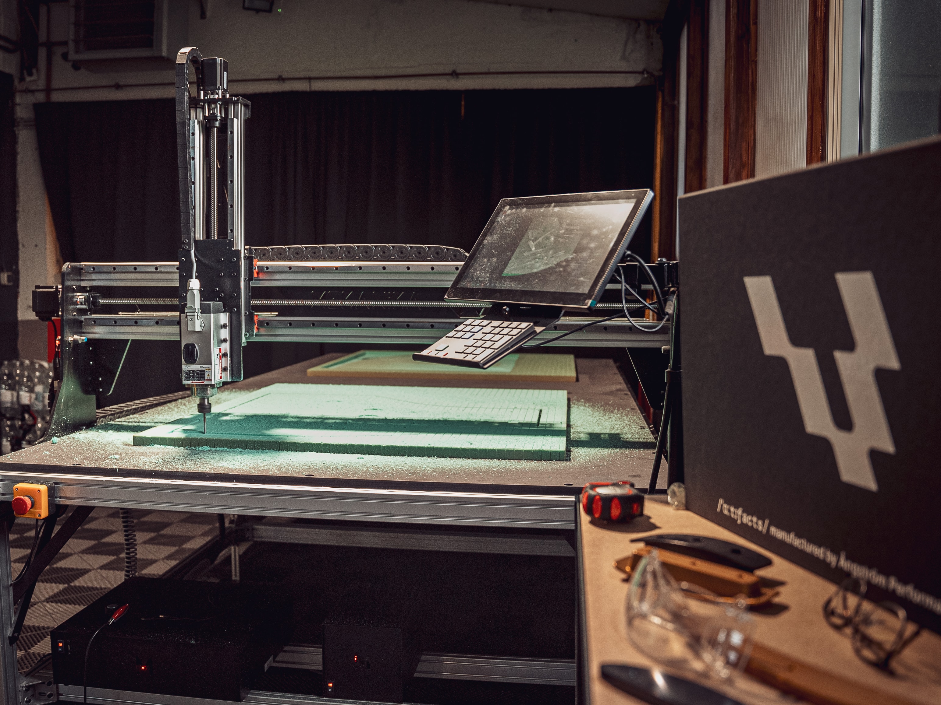 Mekanika Fab CNC milling machine view while milling green foam material to make a mold for carbon fiber car parts