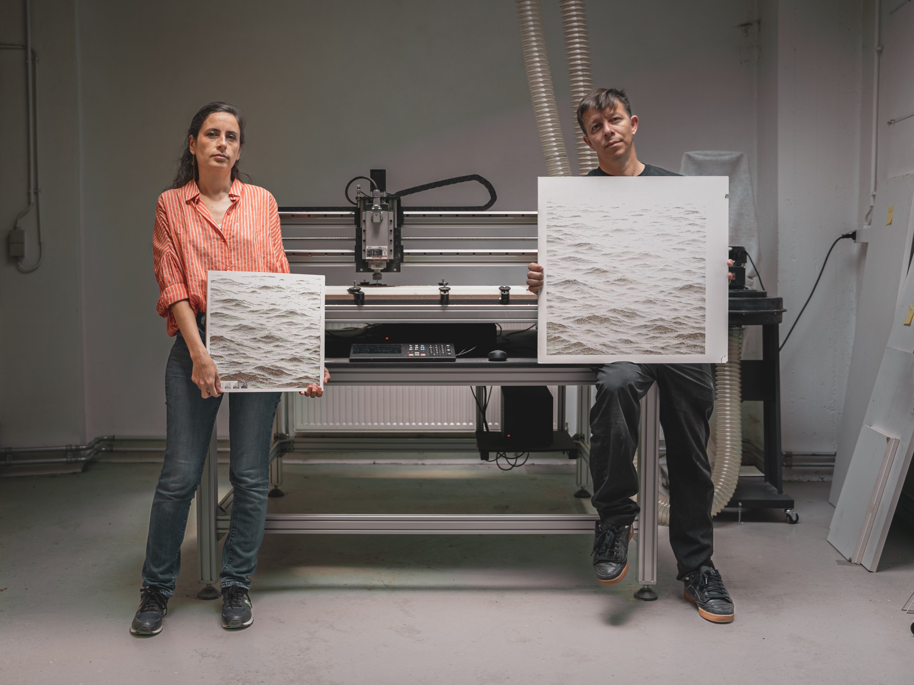 Juliette Bibasse and Joanie Lemercier holding their atworks