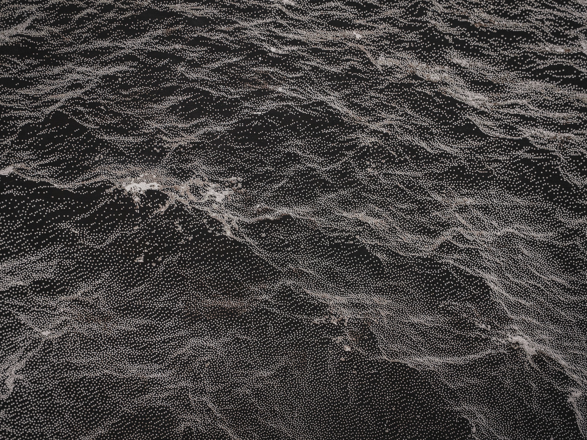 dark panel with engraved wave motive - final art piece by Studio Lemercier