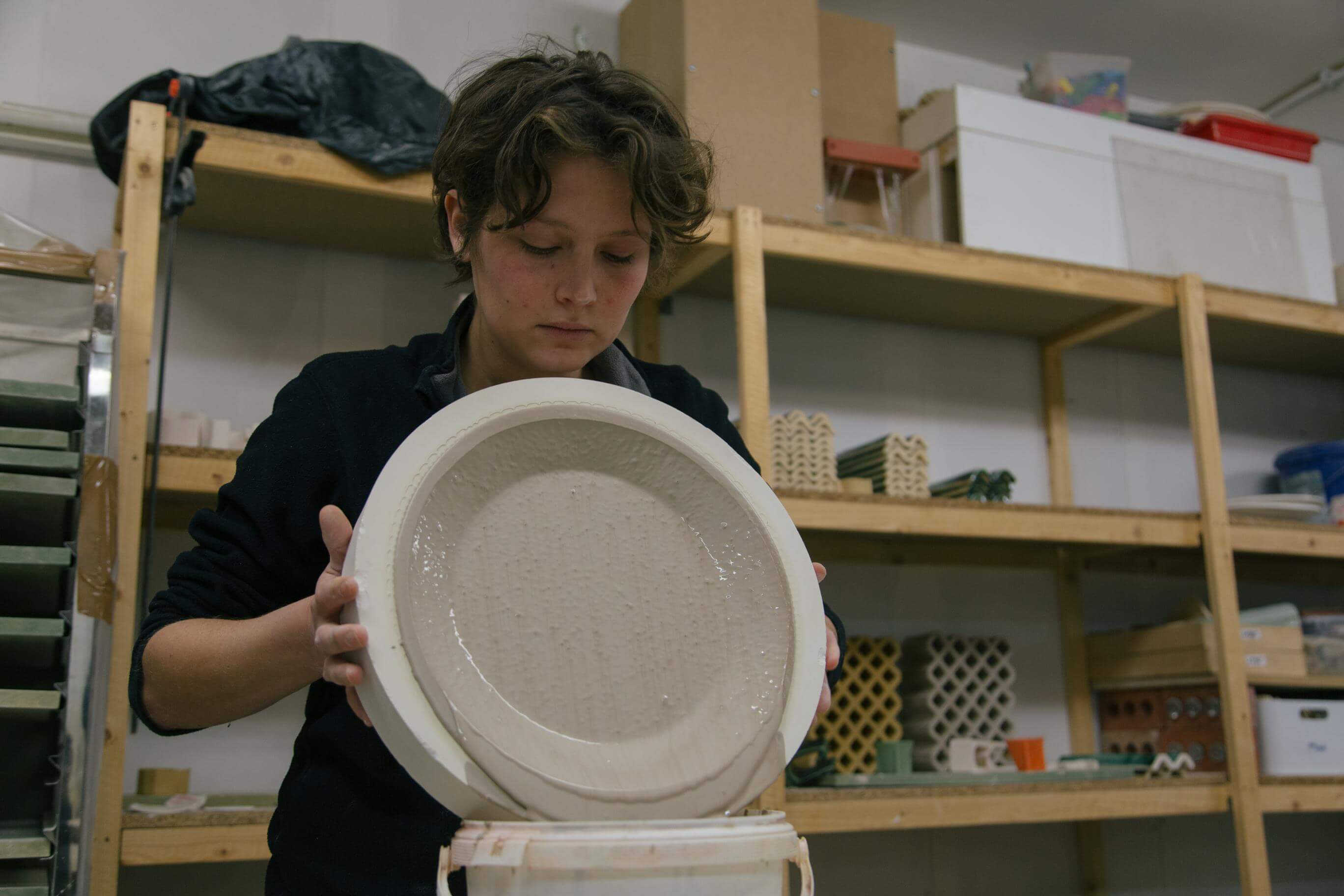 Charlotte from Studio Biskt holding a mold